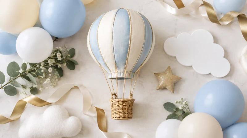 A hot air balloon baby shower color palette in cream, blue, pastel, and gold